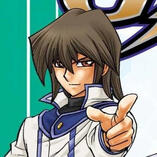 An image of Fubuki Tenjoin/Atticus Rhodes from the Yu-Gi-Oh! GX Manga. he is smiling and pointing at the viewer.